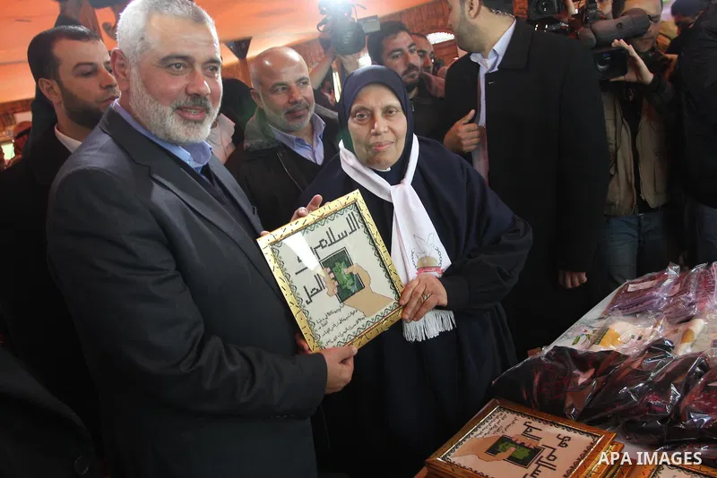 Palestinian Prime Minister in Gaza strip, Ismail Haniyeh attends the opening of ceremony of freed Palestinian female prisoners association, in Gaza city, on Feb. 15, 2014. Photo by Mohammed Asad