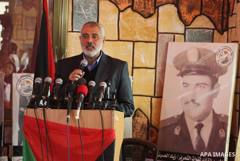 Palestinian Prime Minister in Gaza strip, Ismail Haniyeh speaks during the opening ceremony of freed Palestinian female prisoners association, in Gaza city, on Feb. 15, 2014. Photo by Mohammed Asad