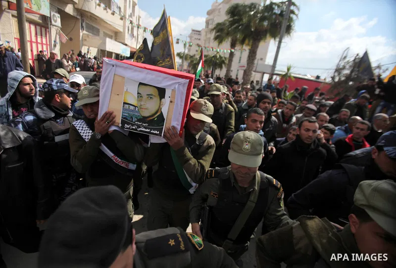 Palestinian security forces carry a coffin containing the remains of Mohammed Shaheen, during a funeral in the West Bank village of Dura, southeast of Hebron, Feb. 10, 2014. Israel on Sunday evening delivered the remains...
