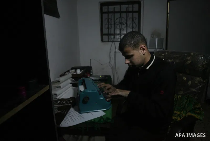 Palestinian Mahmoud Juhaish, 23, a blind youth studies at his house in Rafah refugee camp in southern Gaza strip on Feb. 17, 2014. Juhaish studies at the Islamic University in Gaza City as he suffers blindness, after his...