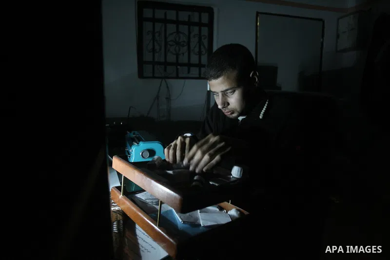 Palestinian Mahmoud Juhaish, 23, a blind youth takes his medicine at his house in Rafah refugee camp in southern Gaza strip on Feb. 17, 2014. Juhaish studies at the Islamic University in Gaza City as he suffers blindness...
