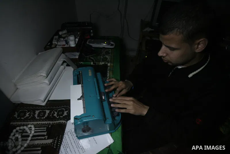 Palestinian Mahmoud Juhaish, 23, a blind youth studies at his house in Rafah refugee camp in southern Gaza strip on Feb. 17, 2014. Juhaish studies at the Islamic University in Gaza City as he suffers blindness, after his...