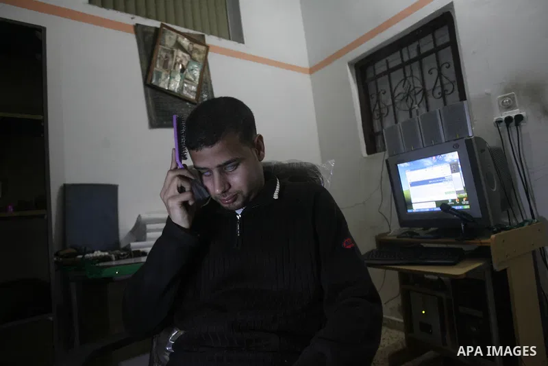 Palestinian Mahmoud Juhaish, 23, a blind youth combs his hair at his house in Rafah refugee camp in southern Gaza strip on Feb. 17, 2014. Juhaish studies at the Islamic University in Gaza City as he suffers blindness, af...