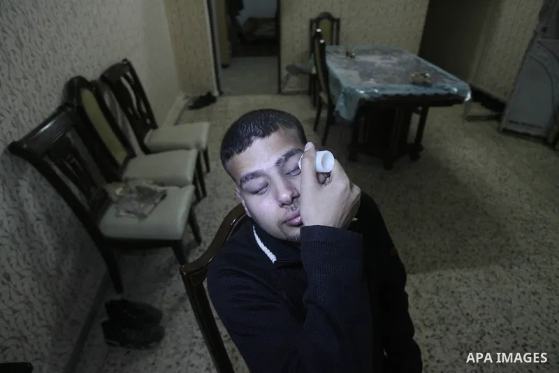 Palestinian Mahmoud Juhaish, 23, a blind youth takes his medicine at his house in Rafah refugee camp in southern Gaza strip on Feb. 17, 2014. Juhaish studies at the Islamic University in Gaza City as he suffers blindness...
