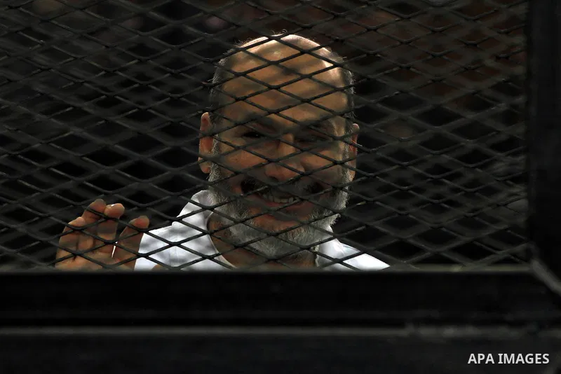 Egyptian members of Muslim Brotherhood, Mohamed Badie and Mohamed el-Beltagy during an initial court hearing held before the Shubra Al-Kheima Criminal Court in Cairo on February 17, 2014. A group of 48 Muslim Brotherhood...