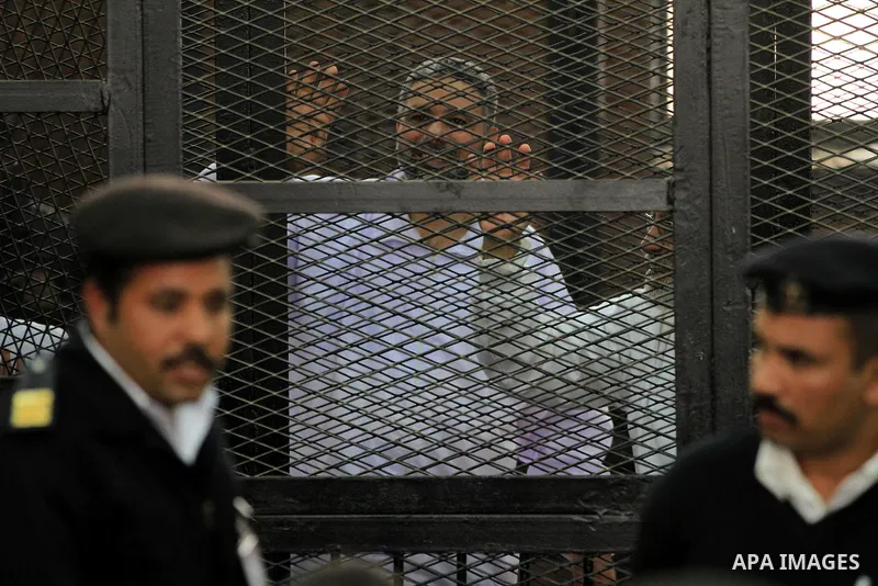 Egyptian members of Muslim Brotherhood, Mohamed Badie and Mohamed el-Beltagy during an initial court hearing held before the Shubra Al-Kheima Criminal Court in Cairo on February 17, 2014. A group of 48 Muslim Brotherhood...