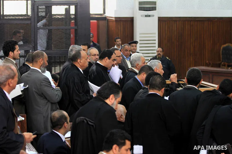 Egyptian members of Muslim Brotherhood, Mohamed Badie and Mohamed el-Beltagy during an initial court hearing held before the Shubra Al-Kheima Criminal Court in Cairo on February 17, 2014. A group of 48 Muslim Brotherhood...