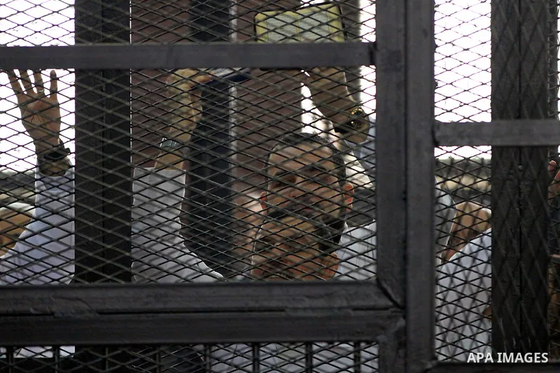 Egyptian members of Muslim Brotherhood, Mohamed Badie and Mohamed el-Beltagy during an initial court hearing held before the Shubra Al-Kheima Criminal Court in Cairo on February 17, 2014. A group of 48 Muslim Brotherhood...