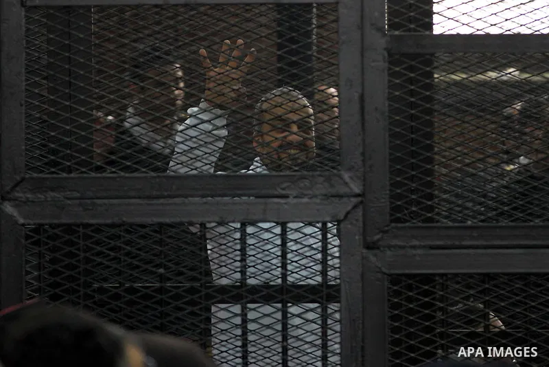 Egyptian members of Muslim Brotherhood, Mohamed Badie and Mohamed el-Beltagy during an initial court hearing held before the Shubra Al-Kheima Criminal Court in Cairo on February 17, 2014. A group of 48 Muslim Brotherhood...