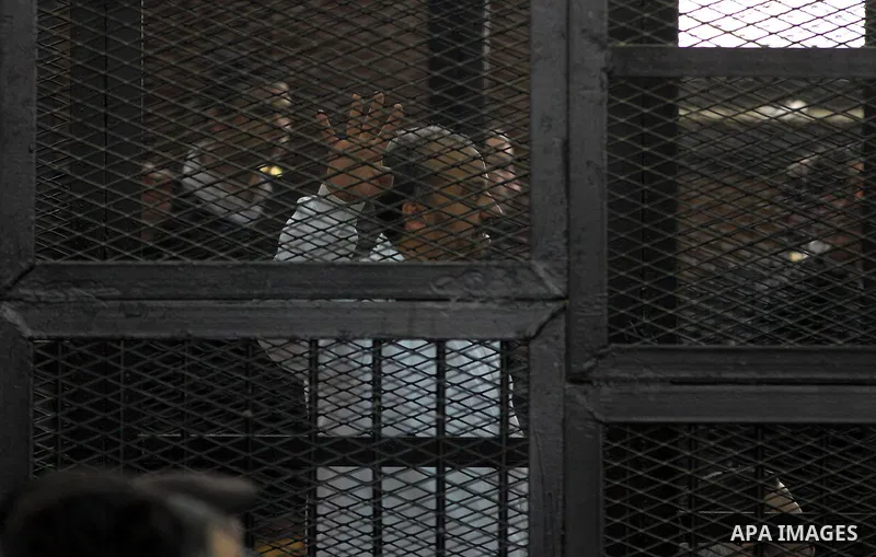 Egyptian members of Muslim Brotherhood, Mohamed Badie and Mohamed el-Beltagy during an initial court hearing held before the Shubra Al-Kheima Criminal Court in Cairo on February 17, 2014. A group of 48 Muslim Brotherhood...