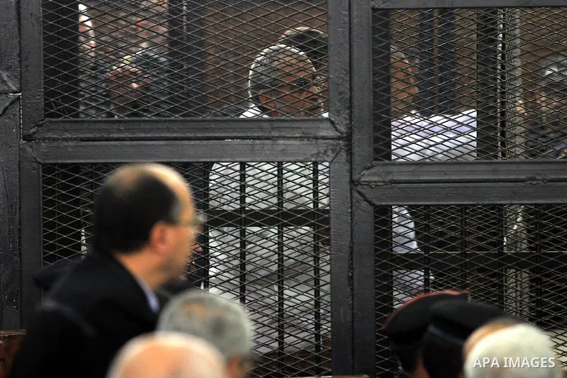 Egyptian members of Muslim Brotherhood, Mohamed Badie and Mohamed el-Beltagy during an initial court hearing held before the Shubra Al-Kheima Criminal Court in Cairo on February 17, 2014. A group of 48 Muslim Brotherhood...