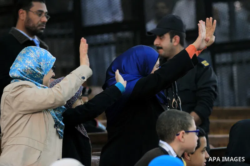 Egyptian members of Muslim Brotherhood, Mohamed Badie and Mohamed el-Beltagy during an initial court hearing held before the Shubra Al-Kheima Criminal Court in Cairo on February 17, 2014. A group of 48 Muslim Brotherhood...