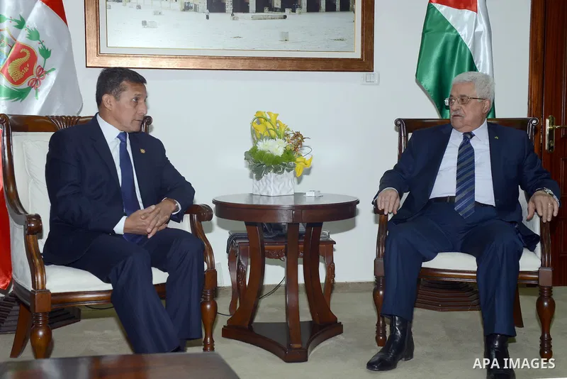 Palestinian Authority President Mahmud Abbas (R) meets with the Peru's President Ollanta Humala in the West Bank city of Ramallah February 18 2014. Peruvian President Ollanta Humala is on an official visit to the Palesti...