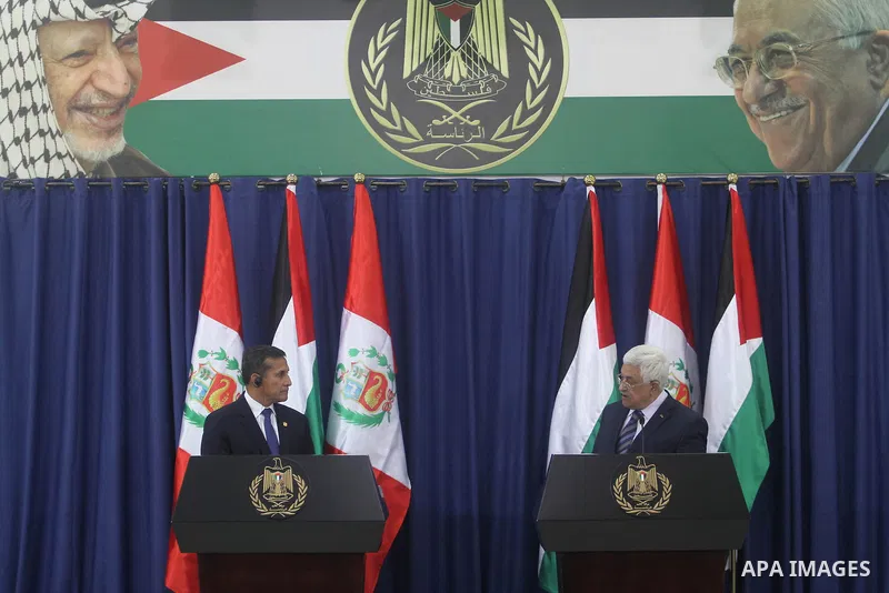 Palestinian President Mahmoud Abbas, right and Peru's President Ollanta Humala speak during a joint press conference in the West Bank city of Ramallah, Tuesday, Feb. 18, 2014. Peruvian President Ollanta Humala is on an o...