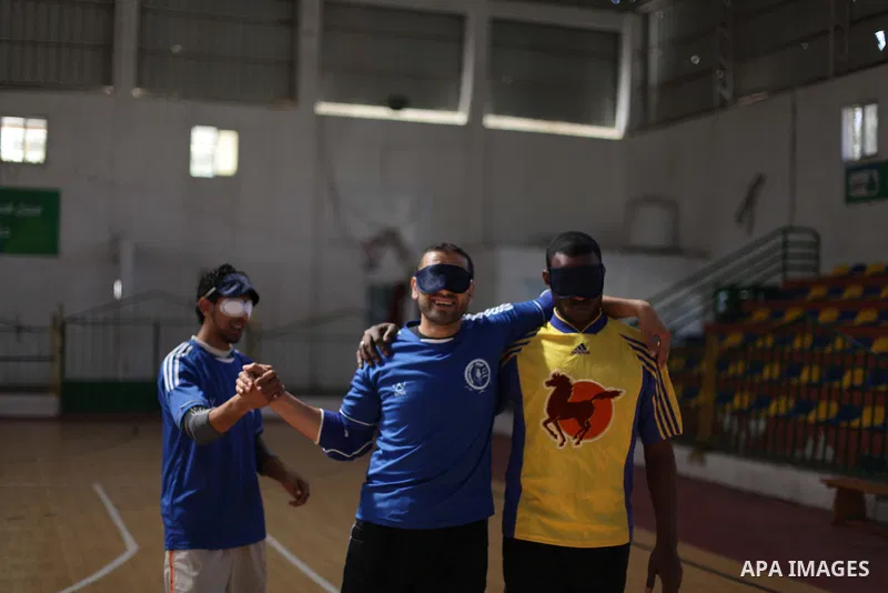 Palestinian blind goalball players compete during a training course, in Gaza city on Feb. 18, 2014. Photo by Ashraf Amra