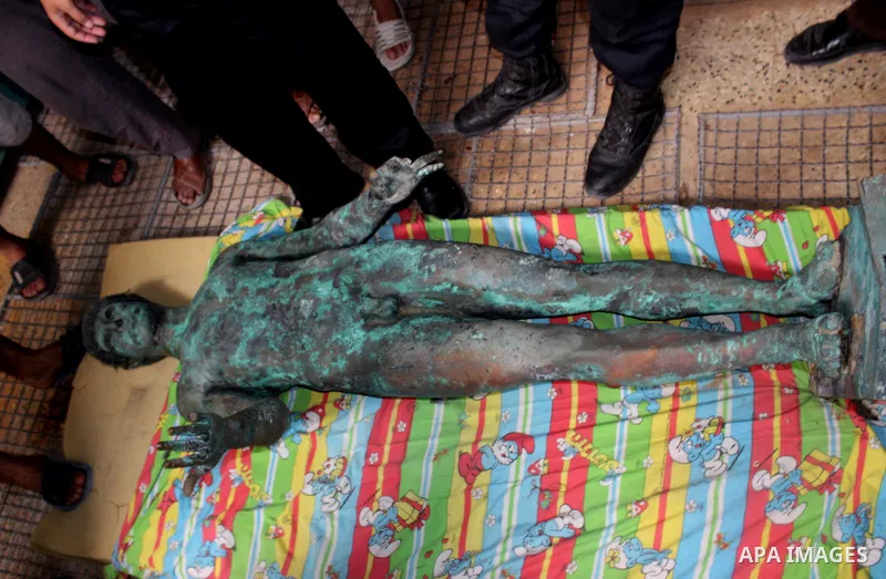 A picture taken on September 19, 2013 shows a 2,500-year-old bronze statue of the Greek god Apollo discovered by Palestinian fishermen last August. Lost for centuries, the rare bronze statue of the Greek God Apollo has m...