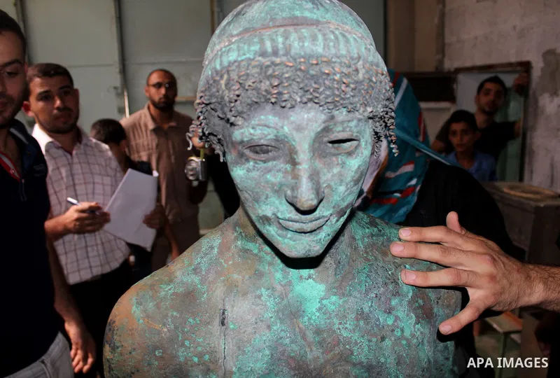 A picture taken on September 19, 2013 shows a 2,500-year-old bronze statue of the Greek god Apollo discovered by Palestinian fishermen last August. Lost for centuries, the rare bronze statue of the Greek God Apollo has m...