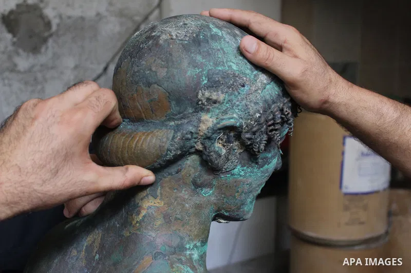 A picture taken on September 19, 2013 shows a 2,500-year-old bronze statue of the Greek god Apollo discovered by Palestinian fishermen last August. Lost for centuries, the rare bronze statue of the Greek God Apollo has m...