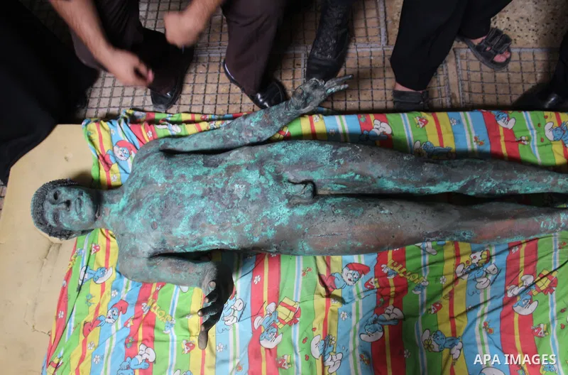A picture taken on September 19, 2013 shows a 2,500-year-old bronze statue of the Greek god Apollo discovered by Palestinian fishermen last August. Lost for centuries, the rare bronze statue of the Greek God Apollo has m...