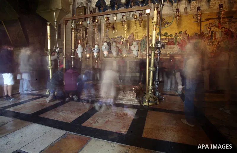 Greek Orthodox worshipers pray at the Church of the Holy Sepulchre, in Jerusalem's Old City, February 19, 2014. Photo by Saeed Qaq
