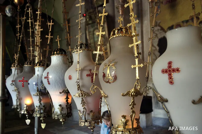 Greek Orthodox worshipers pray at the Church of the Holy Sepulchre, in Jerusalem's Old City, February 19, 2014. Photo by Saeed Qaq