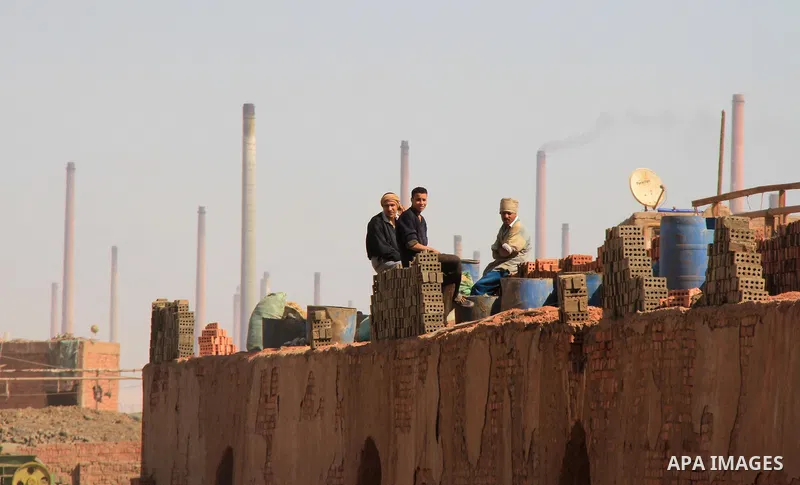 Egyptian laborers rest at a brick factory facility in the suburb of Helwan, Cairo, Egypt on February 19, 2014. Egypt’s unemployment rate remained unchanged in the fourth quarter of 2013 at 13.4 percent of a labour force...