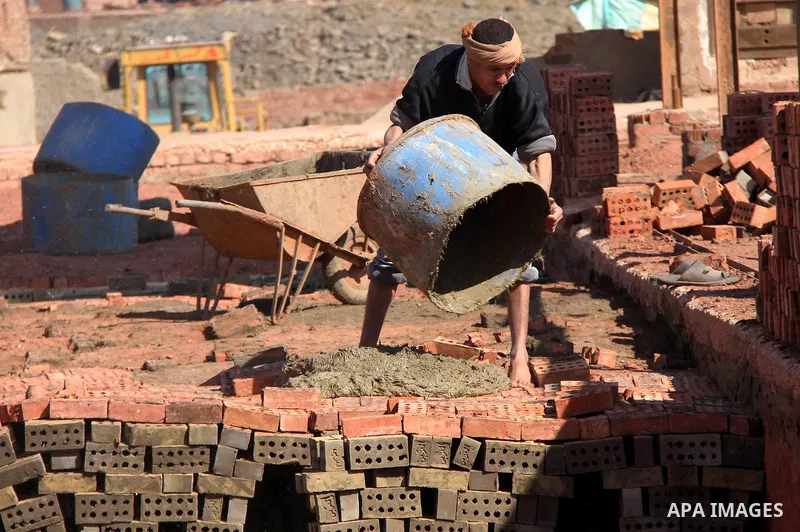 An Egyptian laborer works at a brick factory facility in the suburb of Helwan, Cairo, Egypt on February 19, 2014. Egypt’s unemployment rate remained unchanged in the fourth quarter of 2013 at 13.4 percent of a labour for...