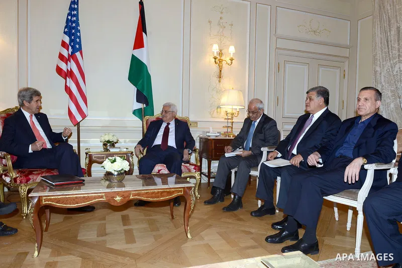 Palestinian President, Mahmoud Abbas (Abu Mazen) meets with U.S. Secretary of State John Kerry, in Paris, on Feb. 19, 2014. Photo by Thaer Ganaim