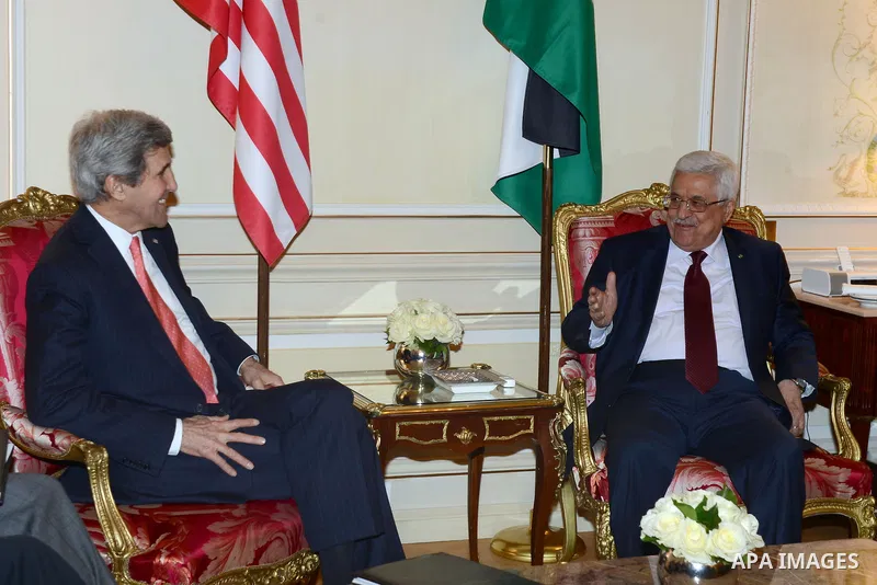 Palestinian President, Mahmoud Abbas (Abu Mazen) meets with U.S. Secretary of State John Kerry, in Paris, on Feb. 19, 2014. Photo by Thaer Ganaim