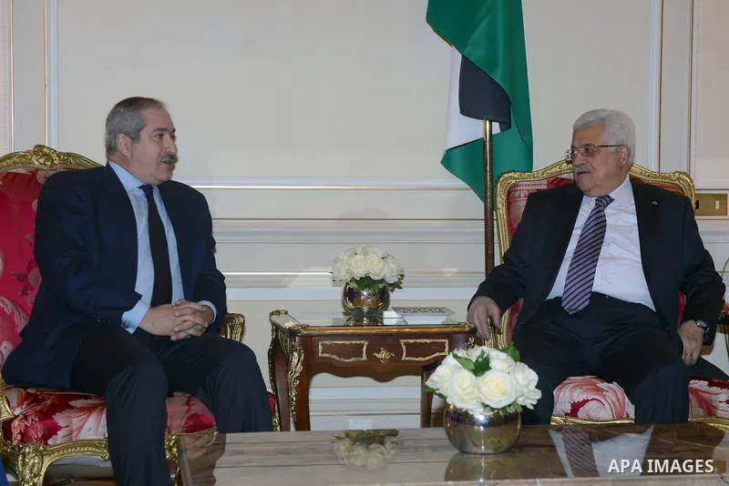 Palestinian President, Mahmoud Abbas (Abu Mazen) meets with Jordanian Foreign Minister Nasser Judeh, in Paris, on Feb. 20, 2014. Photo by Thaer Ganaim