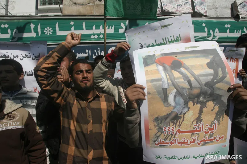 Palestinians take part in a protest in solidarity with Muslims in Central African Republic, in Rafah in the southern Gaza Strip February 20, 2014. Heavy fighting erupted near the airport in Central African Republic's cap...