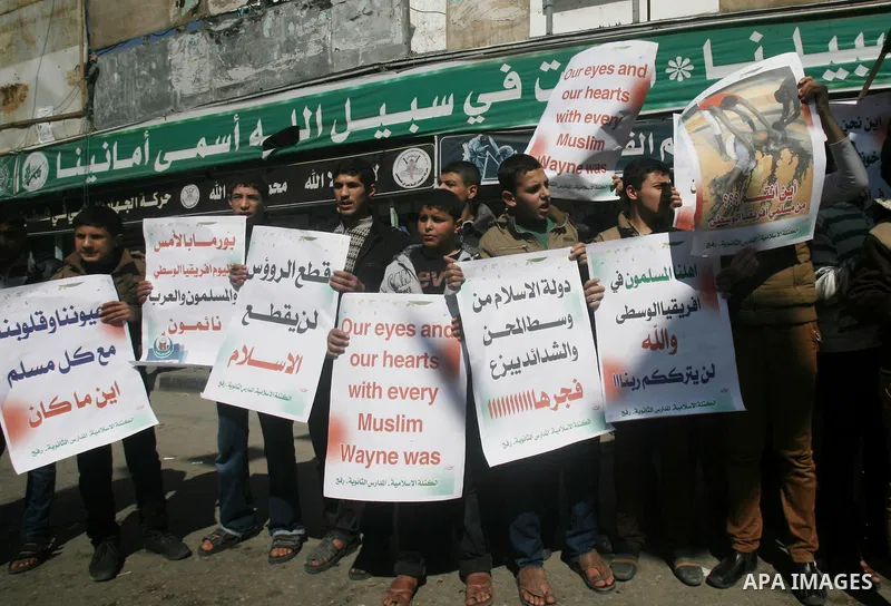 Palestinians take part in a protest in solidarity with Muslims in Central African Republic, in Rafah in the southern Gaza Strip February 20, 2014. Heavy fighting erupted near the airport in Central African Republic's cap...