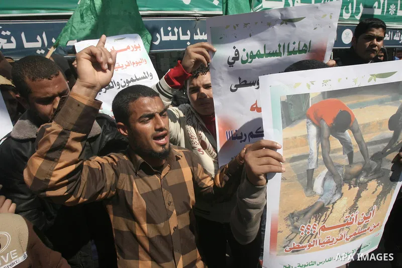 Palestinians take part in a protest in solidarity with Muslims in Central African Republic, in Rafah in the southern Gaza Strip February 20, 2014. Heavy fighting erupted near the airport in Central African Republic's cap...