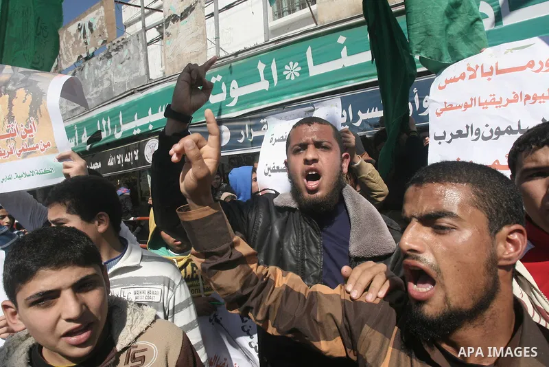 Palestinians take part in a protest in solidarity with Muslims in Central African Republic, in Rafah in the southern Gaza Strip February 20, 2014. Heavy fighting erupted near the airport in Central African Republic's cap...