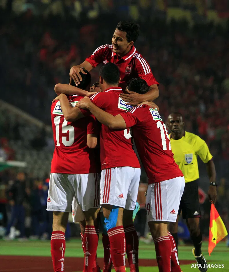 Players of Egypt's Al-Ahly celebrate after scoring against Tunisia's CS Sfaxien during their African Super Cup soccer match at Cairo Stadium February 20, 2014. Photo by Mohammed Bendari