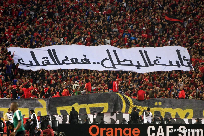 Egypt Al-Ahly fans chant slogans in support of their team ahead of their African Super cup final football match against Tunisia's Club Sportif Sfaxien in Cairo on February 20, 2014. Photo by Mohammed Bendari
