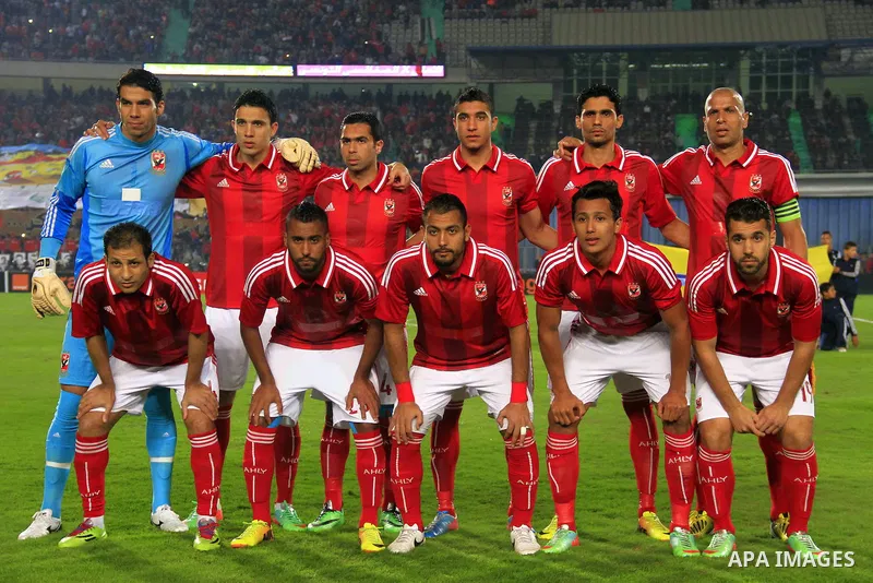 Players of Egypt's Al-Ahly pose for a picture before a match against Tunisia's CS Sfaxien during their African Super Cup soccer at Cairo Stadium February 20, 2014. Photo by Mohammed Bendari