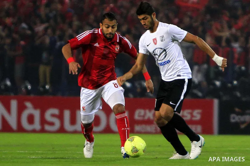 Egyptian players of Al-Ahly club compete with Tunisia's CS Sfaxien during their African Super Cup soccer match at Cairo Stadium February 20, 2014. Photo by Mohammed Bendari