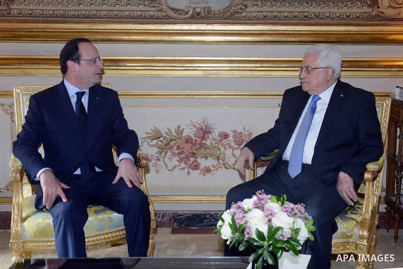 Palestinian President, Mahmoud Abbas (Abu Mazen) meets French President Francois Holland in Paris on Feb. 21, 2014. Photo by Thaer Ganaim
