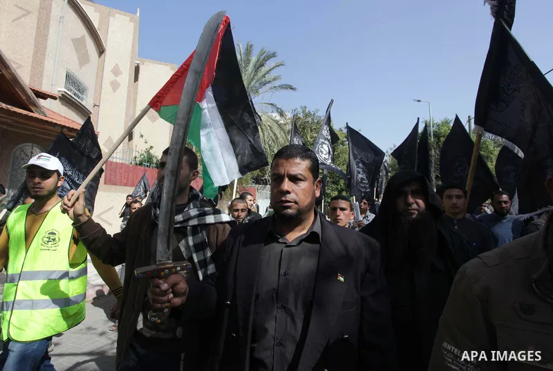 A Palestinian supporter of the Popular Resistance Movement holds a sword during a protest in solidarity with Muslims in Central African Republic, in front of the headquarter United Nation "UNSCO" in Gaza city, February 2...