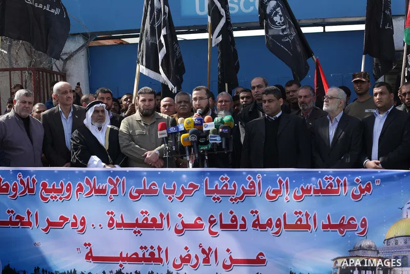 Palestinian supporters of the Popular Resistance Movement take part in a protest in solidarity with Muslims in Central African Republic, in front of the headquarter United Nation "UNSCO" in Gaza city, February 22, 2014....