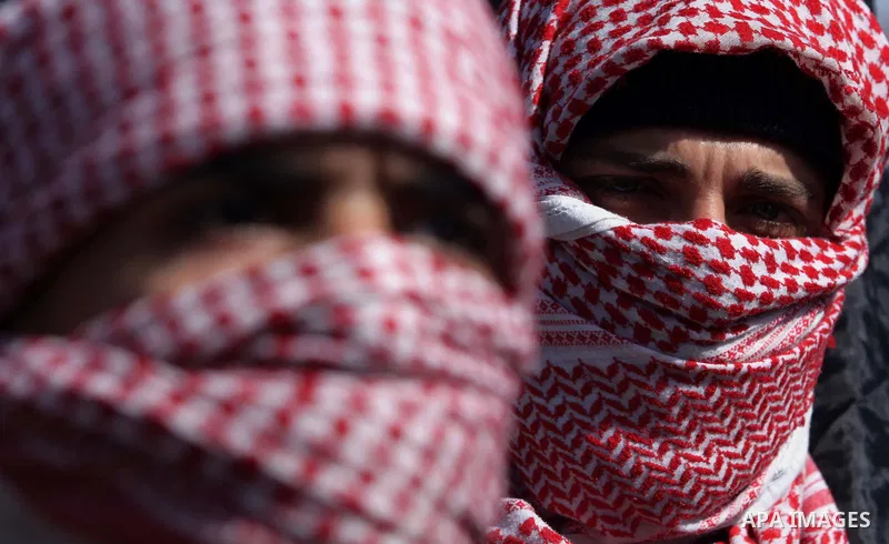 Masked Palestinian supporters of the Popular Resistance Movement take part in a protest in solidarity with Muslims in Central African Republic, in front of the headquarter United Nation "UNSCO" in Gaza city, February 22,...