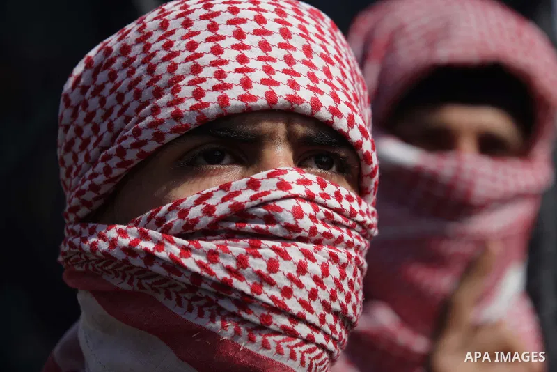Masked Palestinian supporters of the Popular Resistance Movement take part in a protest in solidarity with Muslims in Central African Republic, in front of the headquarter United Nation "UNSCO" in Gaza city, February 22,...