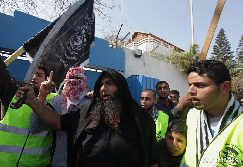 A Palestinian supporter of the Popular Resistance Movement holds a sword during a protest in solidarity with Muslims in Central African Republic, in front of the headquarter United Nation "UNSCO" in Gaza city, February 2...