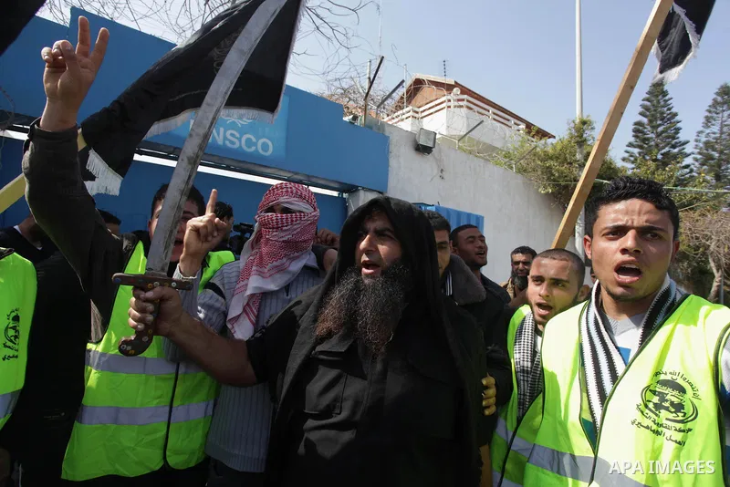A Palestinian supporter of the Popular Resistance Movement holds a sword during a protest in solidarity with Muslims in Central African Republic, in front of the headquarter United Nation "UNSCO" in Gaza city, February 2...