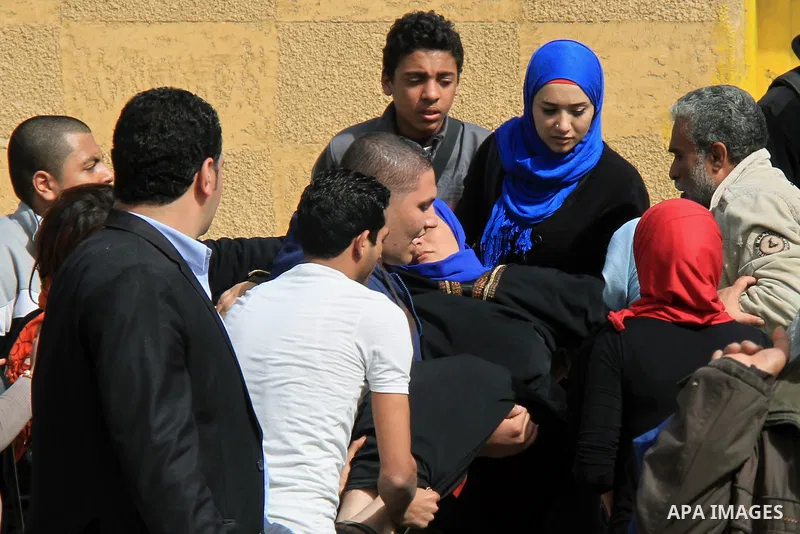 Relatives of the 'Ultras of Revolutionary' who support Muslim Brotherhood clashes with Egyptian security forces outside the Tora jail in Cairo, on Feb. 22, 2014. The court accused the group of violating the demonstration...