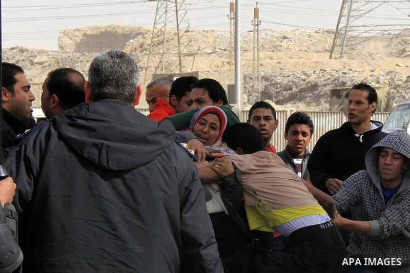 Relatives of the 'Ultras of Revolutionary' who support Muslim Brotherhood clashes with Egyptian security forces outside the Tora jail in Cairo, on Feb. 22, 2014. The court accused the group of violating the demonstration...