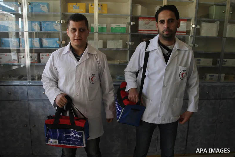 Palestinian doctors work at their clinic in Gaza City, on Feb. 22, 2014. "Ainucar Consulting and medical services" group include the Palestinian graduates doctors, nurses and medical Technology, to overcome unemployment...