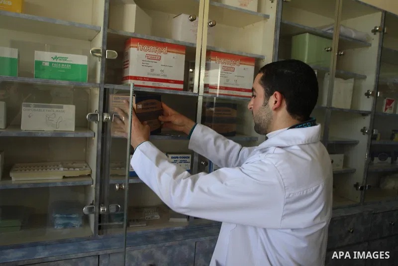 A Palestinian doctor works at the clinic in Gaza City, on Feb. 22, 2014. "Ainucar Consulting and medical services" group include the Palestinian graduates doctors, nurses and medical Technology, to overcome unemployment...