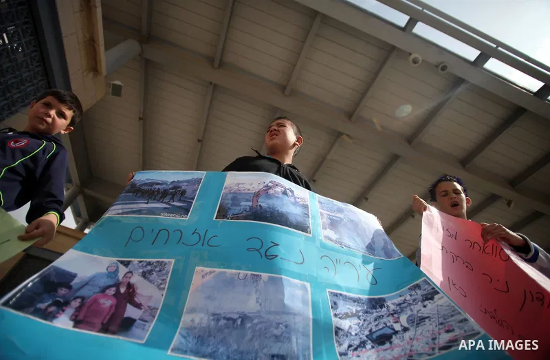 Palestinian members of Al Sawahra family celebrate Daoud Al Sawahra, 5, birthday at the yard of Jerusalem Municipality in a protest against demolishing their house by Israeli authority in Jerusalem, on Feb. 23, 2014. Isr...